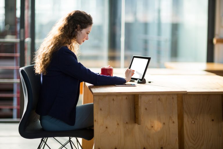 female business executive using digital tablet