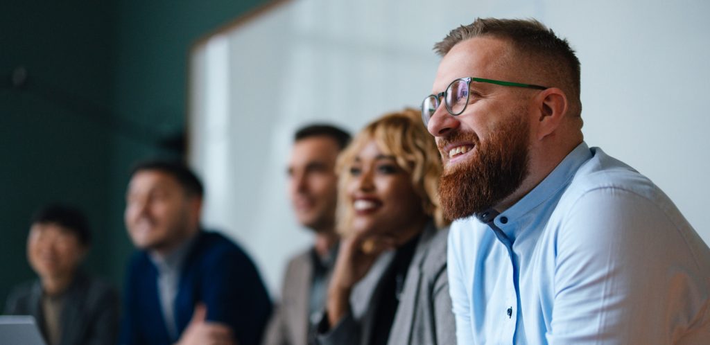 Businesspeople Listening To A Presentation In an Office
